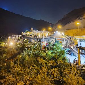 High angle view of illuminated street and buildings at night