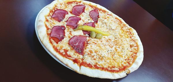 High angle view of pizza in plate on table