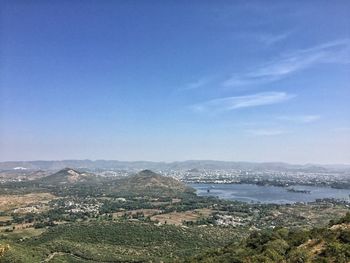 High angle view of landscape against blue sky