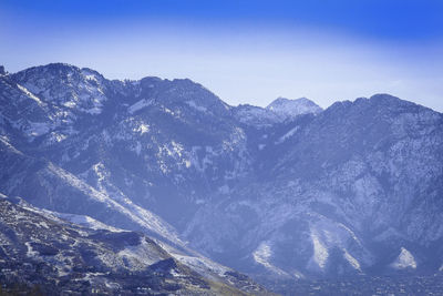 Scenic view of mountains against clear blue sky