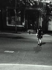 Woman walking on city street