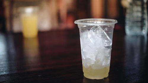 Close-up of ice glass on table