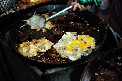 Deep fried flour with mussels and egg at the night weekend thai food called hoi tod at street food