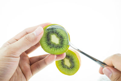 Cropped image of person holding apple