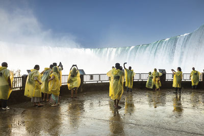 Rear view of people on wet rainy day