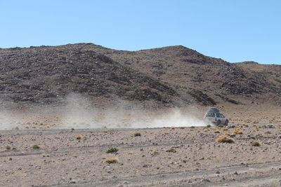 Scenic view of desert against clear sky