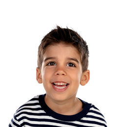 Portrait of smiling boy against white background