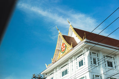 Low angle view of building against blue sky