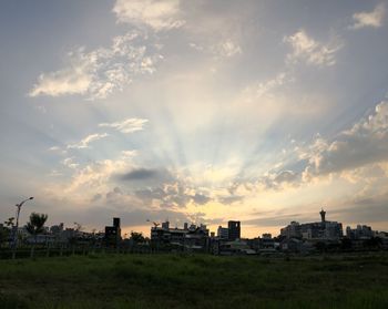 Panoramic view of buildings against sky during sunset