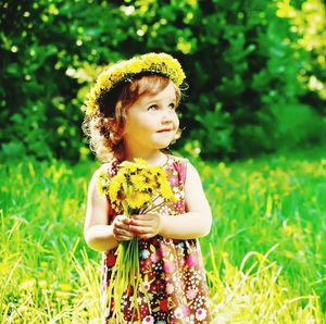 Cute girl standing on field