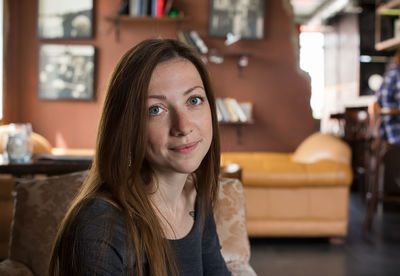 Portrait of smiling woman at home