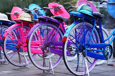 Close-up of bicycles parked on street