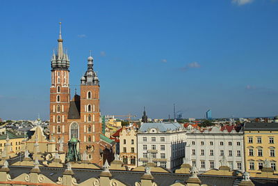 Buildings in city against sky