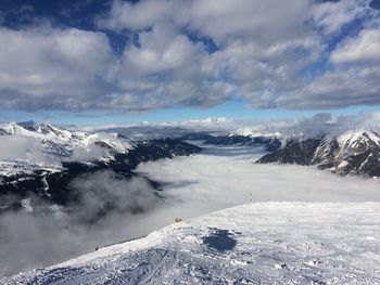 Scenic view of snow mountains against sky