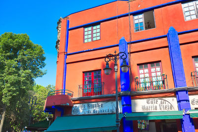 Low angle view of building against blue sky