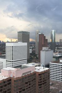 Modern buildings in city against sky