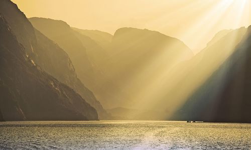 Scenic view of lysefjord at sunset