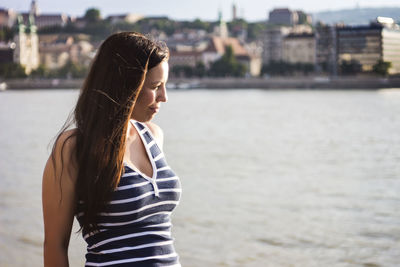 Side view of woman standing in water