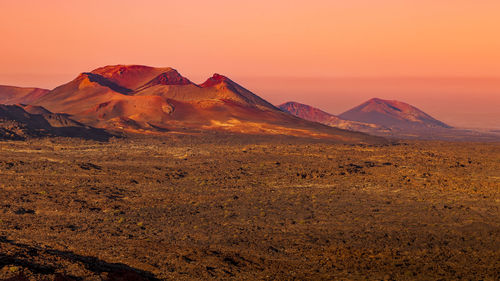 Scenic view of mountains against sky during sunset