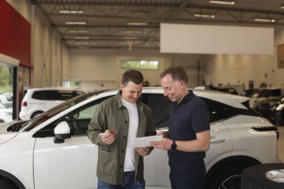 Man in car dealership office