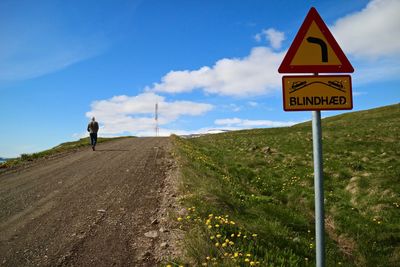 Road signs against sky