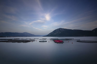 Scenic view of lake against sky during sunset