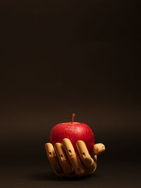 Close-up of apple over black background