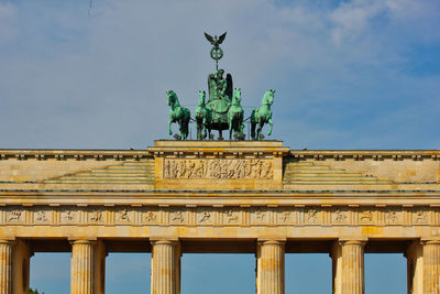 Low angle view of statue against sky