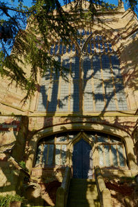 Shadow of tree on building