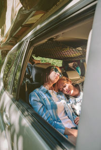 Portrait of happy woman in car