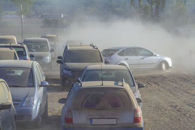 Rear view of traffic on road in city