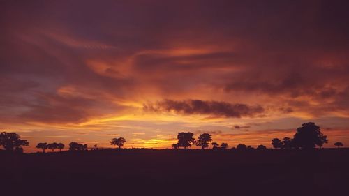 Scenic view of silhouette landscape against sky during sunset