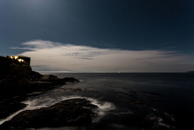 Scenic view of sea against sky at night