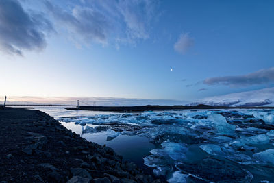 Scenic view of sea against sky during winter