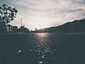 Road by city against sky