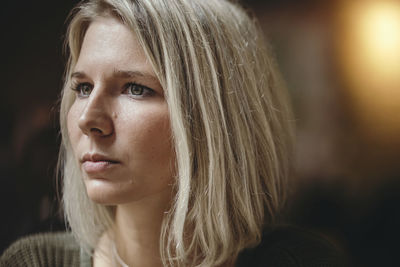 Thoughtful young woman in coffee shop