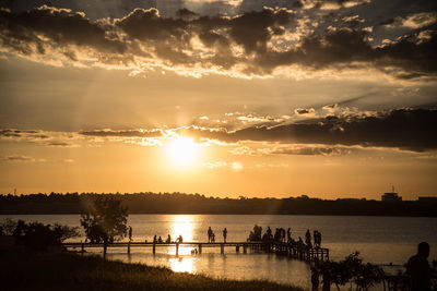 Scenic view of river against sky during sunset