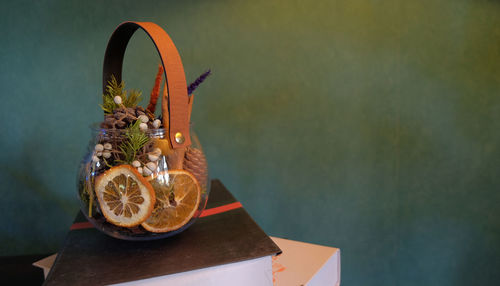 Close-up of orange flower on table