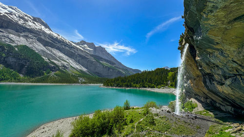 Scenic view of lake and mountains against sky