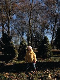 Full length of girl standing at park at morning