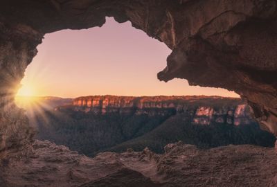 Scenic view of rock formation against sky during sunset