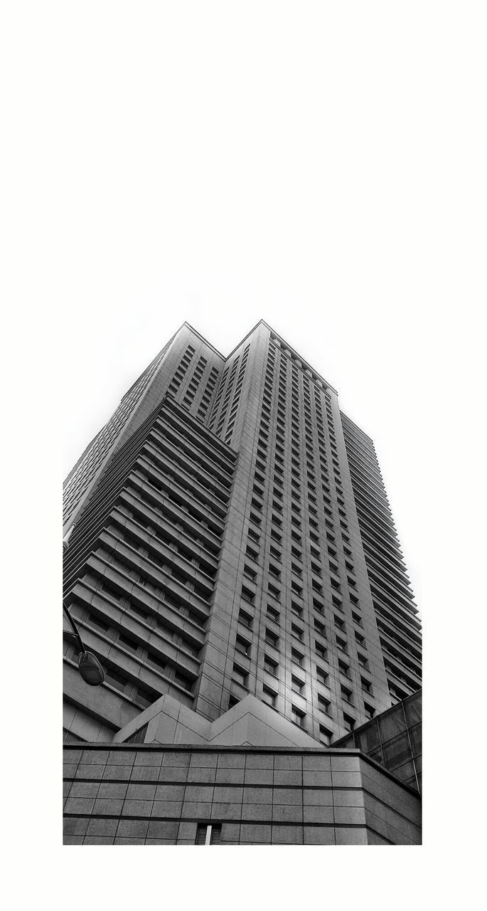 LOW ANGLE VIEW OF SKYSCRAPERS AGAINST CLEAR SKY