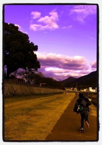 transfer print, sky, auto post production filter, cloud - sky, men, lifestyles, person, cloud, tree, leisure activity, full length, building exterior, built structure, walking, architecture, cloudy, outdoors, landscape, field