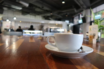 Coffee cup on table in cafe