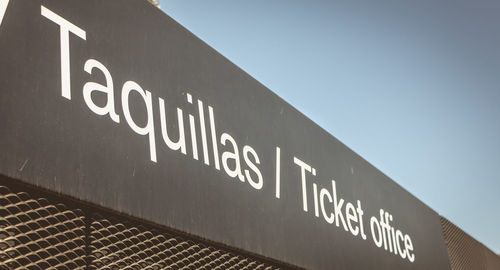 Low angle view of information sign against clear sky