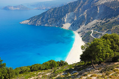 High angle view of bay against clear blue sky