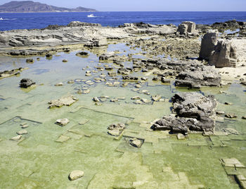 High angle view of castle by lake against sky