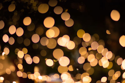 Defocused image of illuminated lights at night