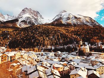 Houses against sky during winter