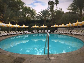 View of swimming pool against blue sky